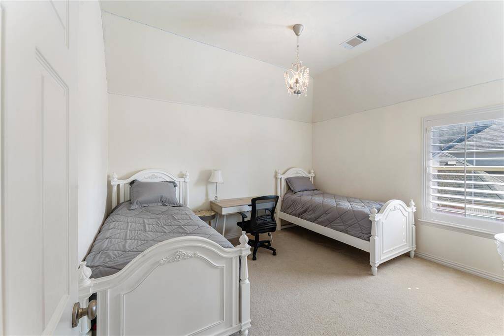 The secondary bedroom is thoughtfully connected to the Jack and Jill bathroom, offering both convenience and privacy for family members. This well-appointed space provides easy access to the shared bathroom while maintaining a cozy, functional layout.