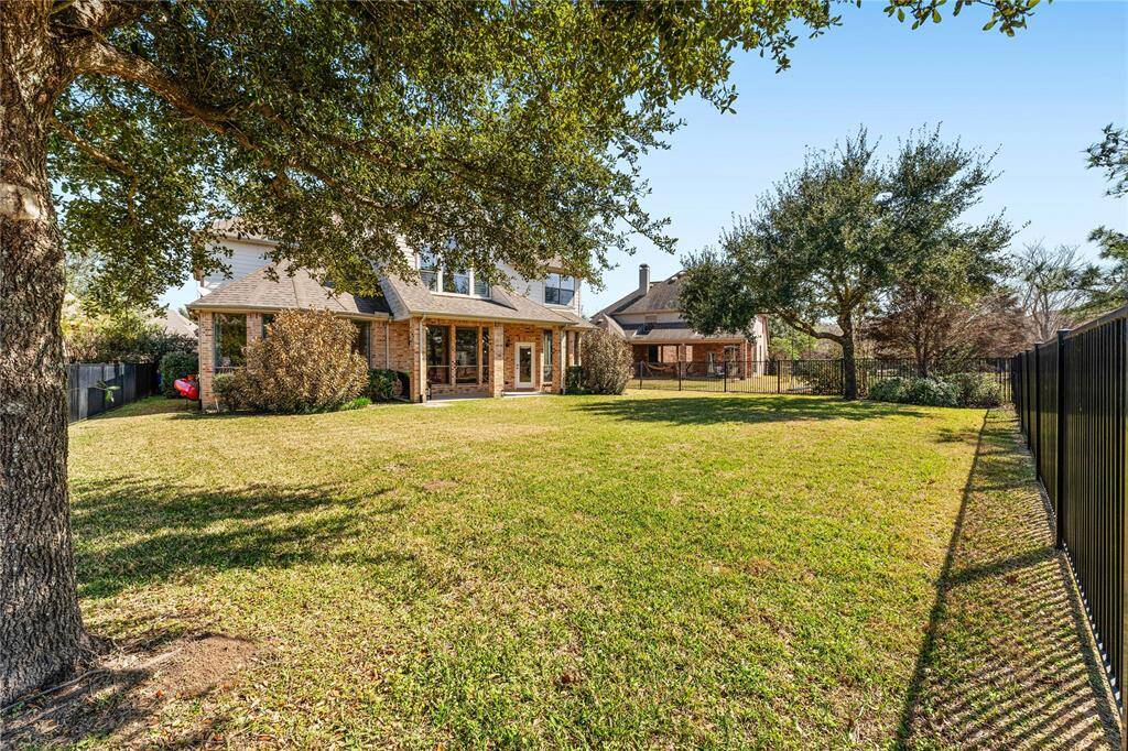 The large backyard offers plenty of space to unleash your creativity, whether you envision a beautiful garden, an outdoor kitchen, or a recreational area. With ample room to design your perfect outdoor retreat, the possibilities are endless.
