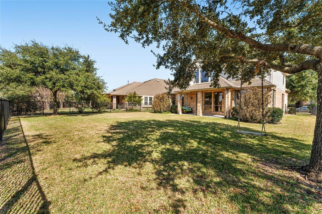 The nice covered patio provides a perfect spot to relax and entertain, offering shade and comfort while enjoying the outdoor surroundings.