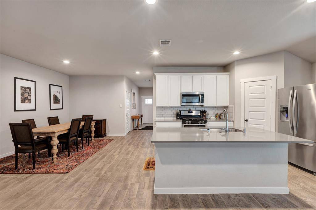 Convenient view of the kitchen, flowing effortlessly into the dining area for easy meal gatherings.