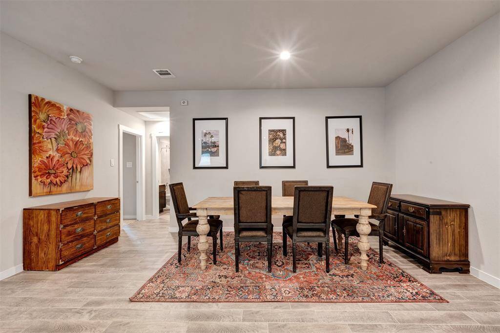 Another view of the dining area, with a glimpse of the doors leading to the bedroom and bathroom for easy access.