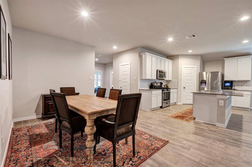 View from the dining room, offering a clear sightline into the kitchen—perfect for entertaining and family meals.