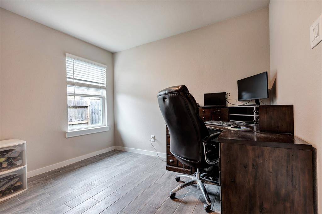 Perfectly suited for a home office, this room offers a quiet and productive space.