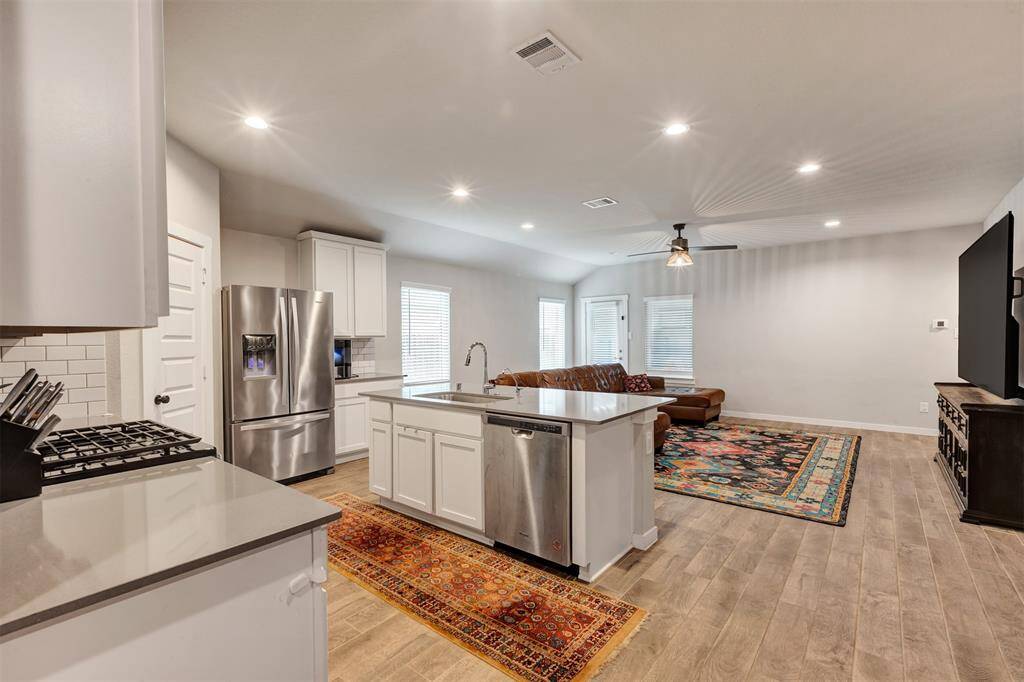 Open view from the kitchen to the living room, creating a seamless flow for easy living and entertaining.