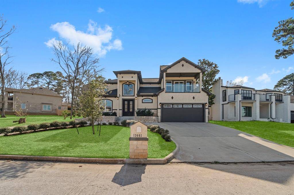 This stunning two-story home features a modern design with a spacious driveway and an attached two-car garage. The well-manicured lawn and elegant facade create an inviting curb appeal. Ideal for family living in a serene neighborhood.