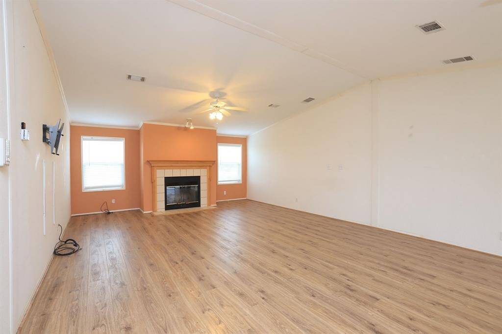 Wood burning fireplace is the centerpiece of the Living room