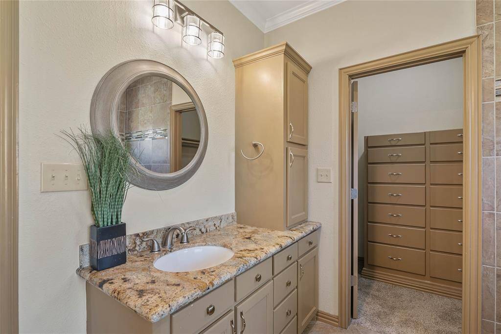Vanity & Sink #1 in primary suite ~ Entrance to Walk-in closet #1