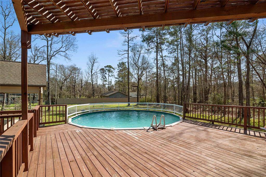Above ground pool with pergola and decking