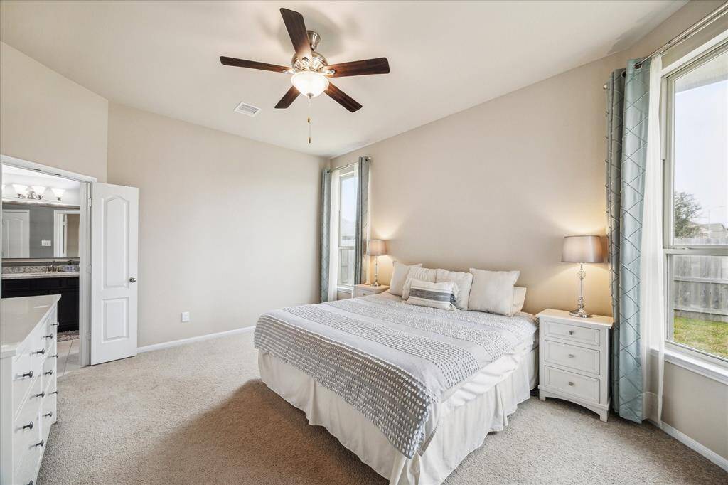 Another view of the Primary bedroom, featuring an en-suite bathroom for comfort and convenience.