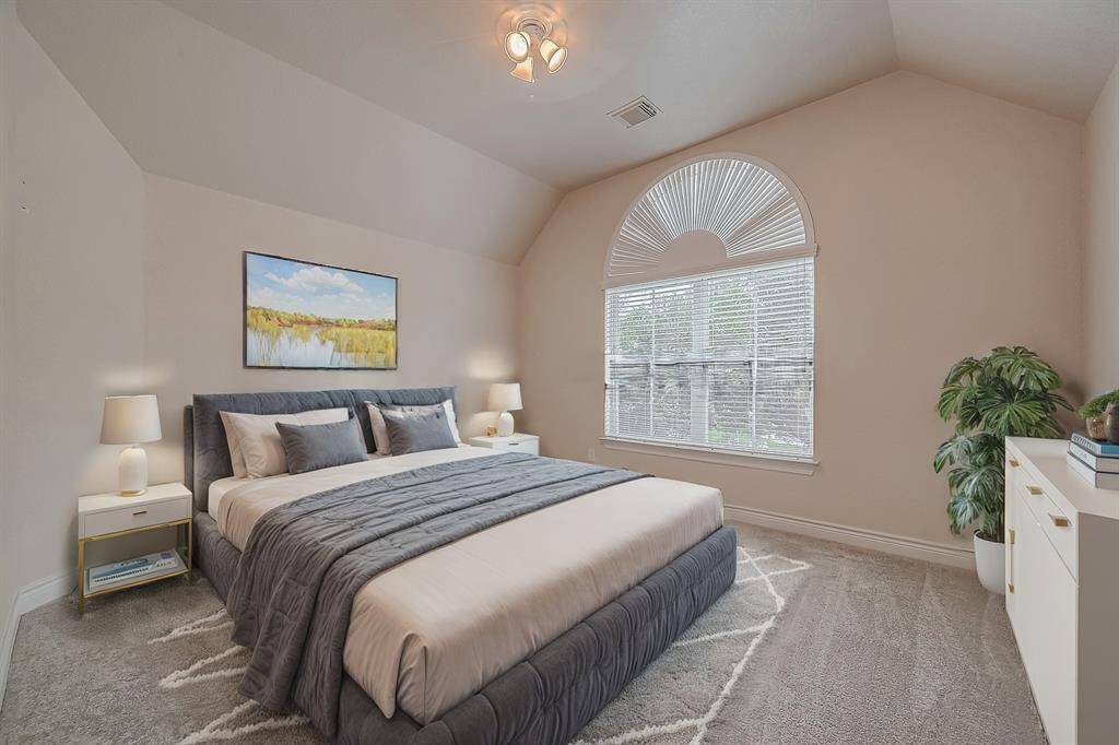 This, one of five secondary bedrooms, is conveniently located just off the game room features LED-lit ceiling fan, fresh carpeting (installed in 2022), fresh paint and ample space for all your furniture.(Virtual Stage)