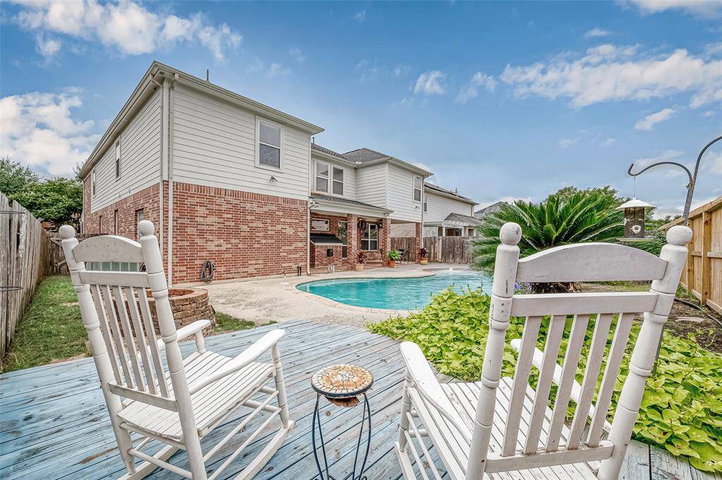 This peaceful wooden decked area creates a tranquil area to sip your coffee in the morning or enjoy an evening beverage with your loved one over looking your backyard oasis.