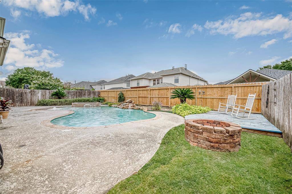 The backyard creates an amazing entertaining space for your outdoor activities.  Whether you're hosting pool parties, evening smores celebrations around the stone wood burning fire pit, musical event with the surround sound system or rocking on your tranquil deck space, this area is ideal for all of the outdoor entertainment and relaxation you can think up.