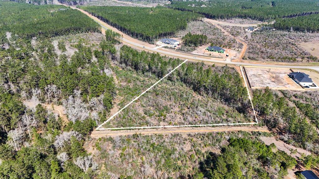 This view shows the drainage along the back of the property and to the right from this view.
