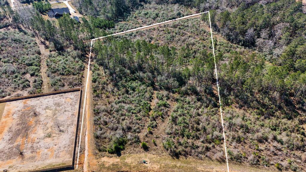 There is a drainage ditch to the left and goes behind the property.