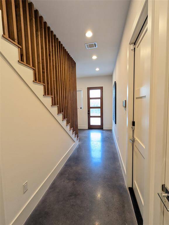 VIEW OF THE FRONT DOOR FROM THE PRIMARY