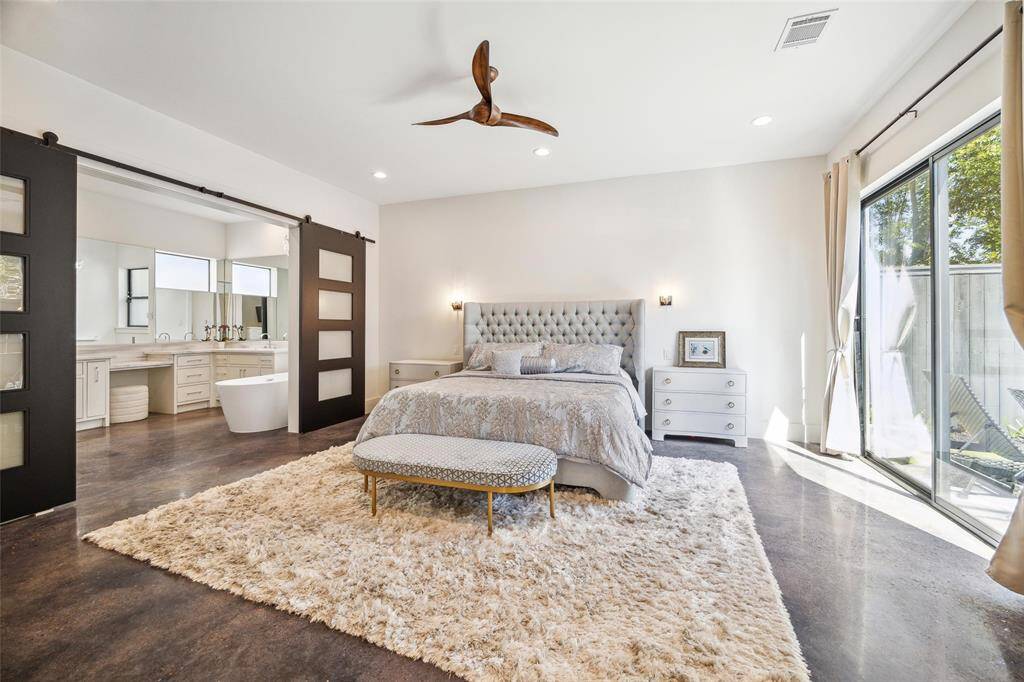 SPACIOUS PRIMARY WITH BARN DOORS THAT LEAD TO THE BATHROOM