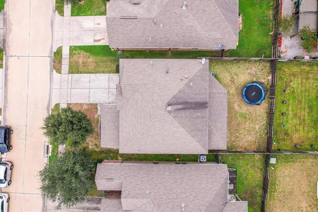 Aerial view of the home nestled on the lot