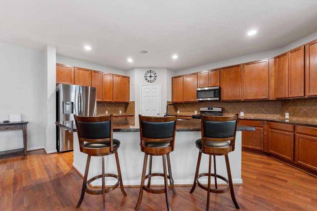 Ample cabinets for storage, walk in pantry