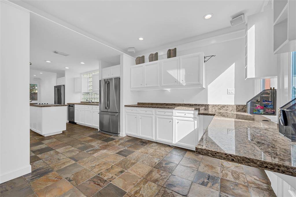 Breakfast room with tons of cabinet storage and views of the garden.