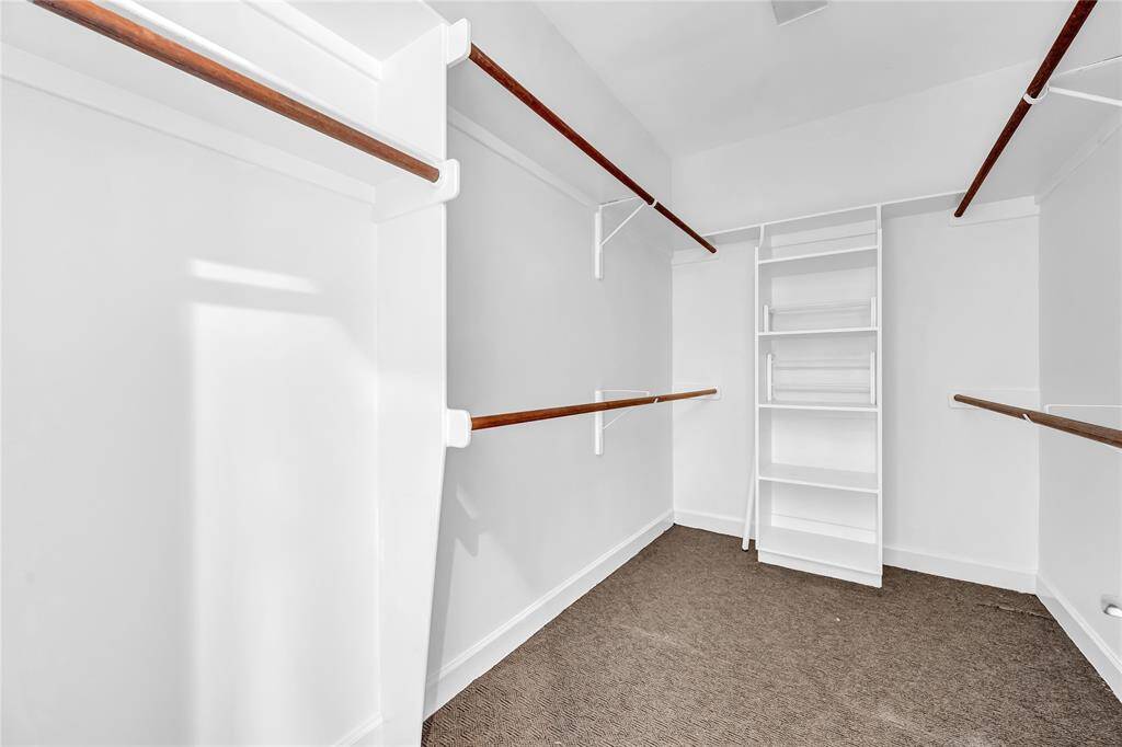 Walk-in closet in the primary suite.