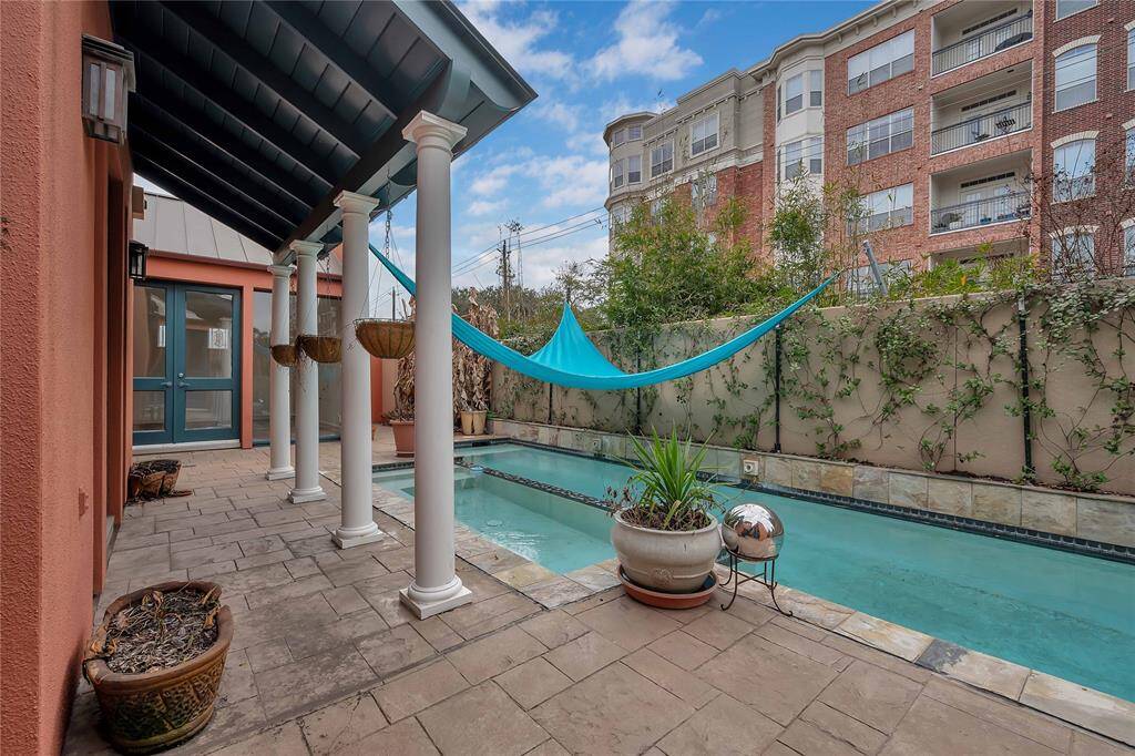 Outdoor patio area that can be used for al fresco dining or lounging by the pool.