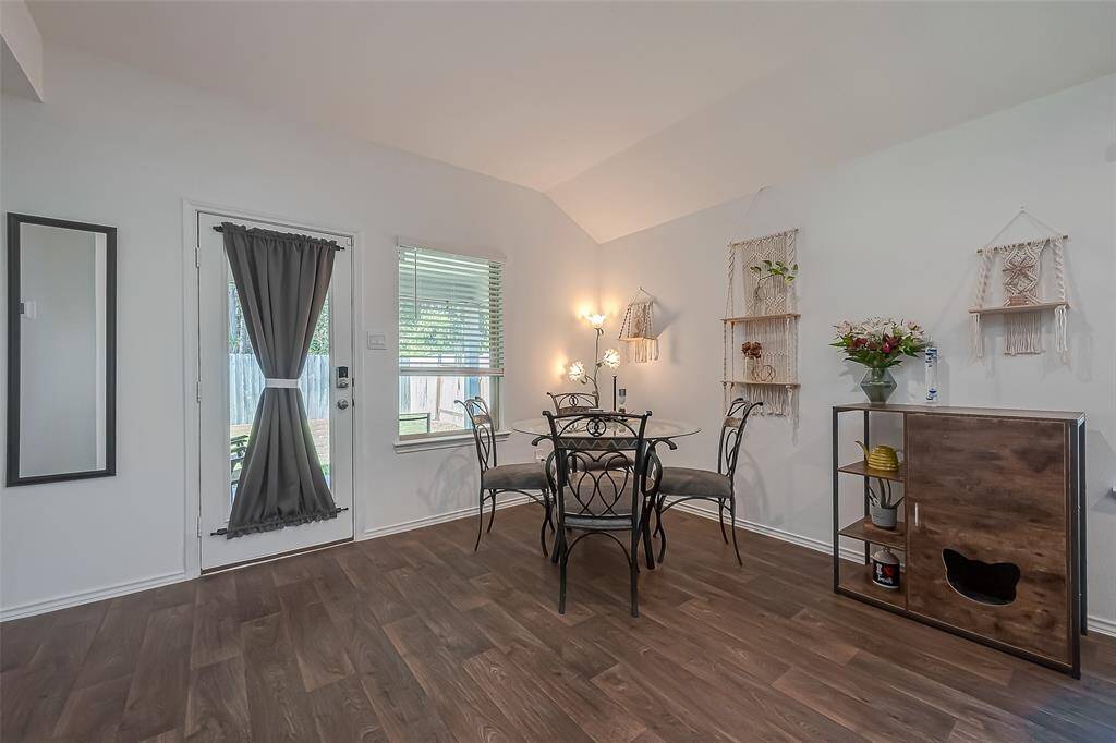 Spacious dining room with patio door that leads to back yard.