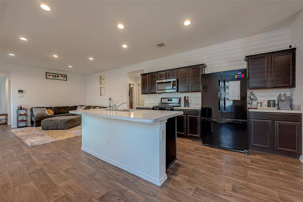 A kitchen view showcasing a bar area.