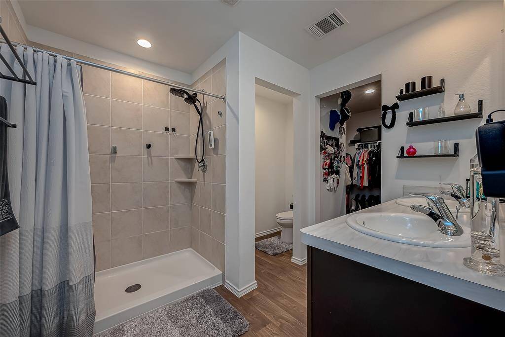 A spacious ensuite complements the master bedroom.