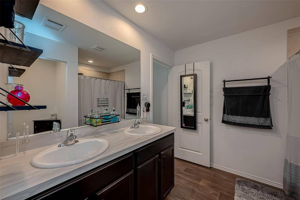 A spacious ensuite complements the master bedroom.