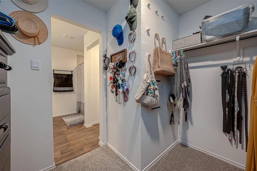 Primary bedroom walk in closet
