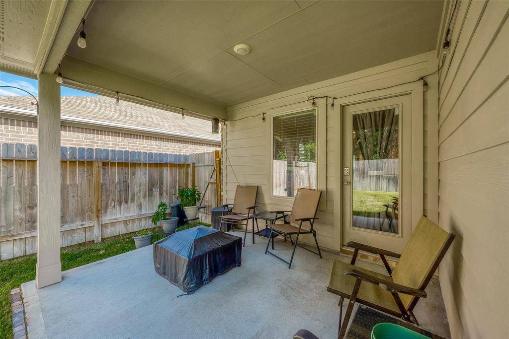 A shaded walk-out patio designed for entertaining