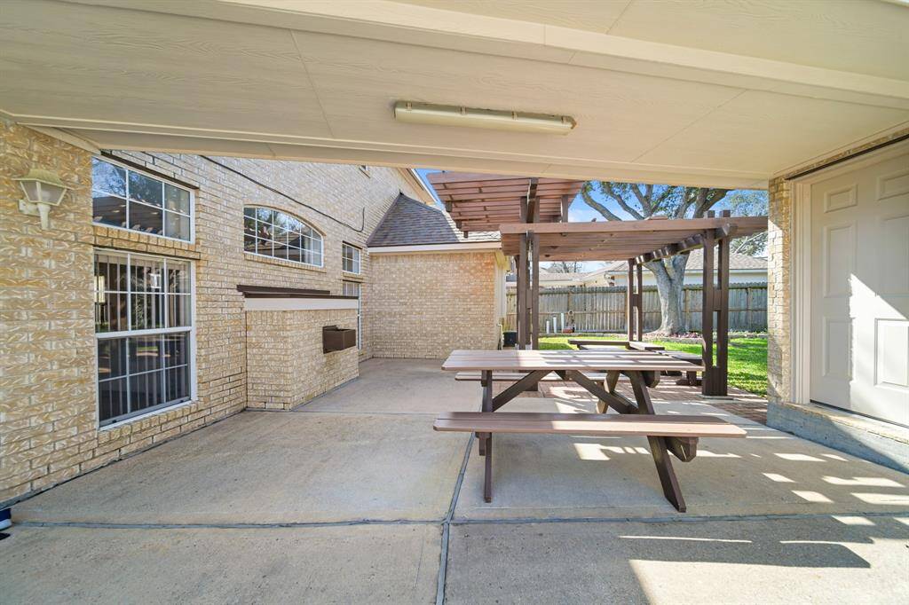 Covered walkway to your detached garage.