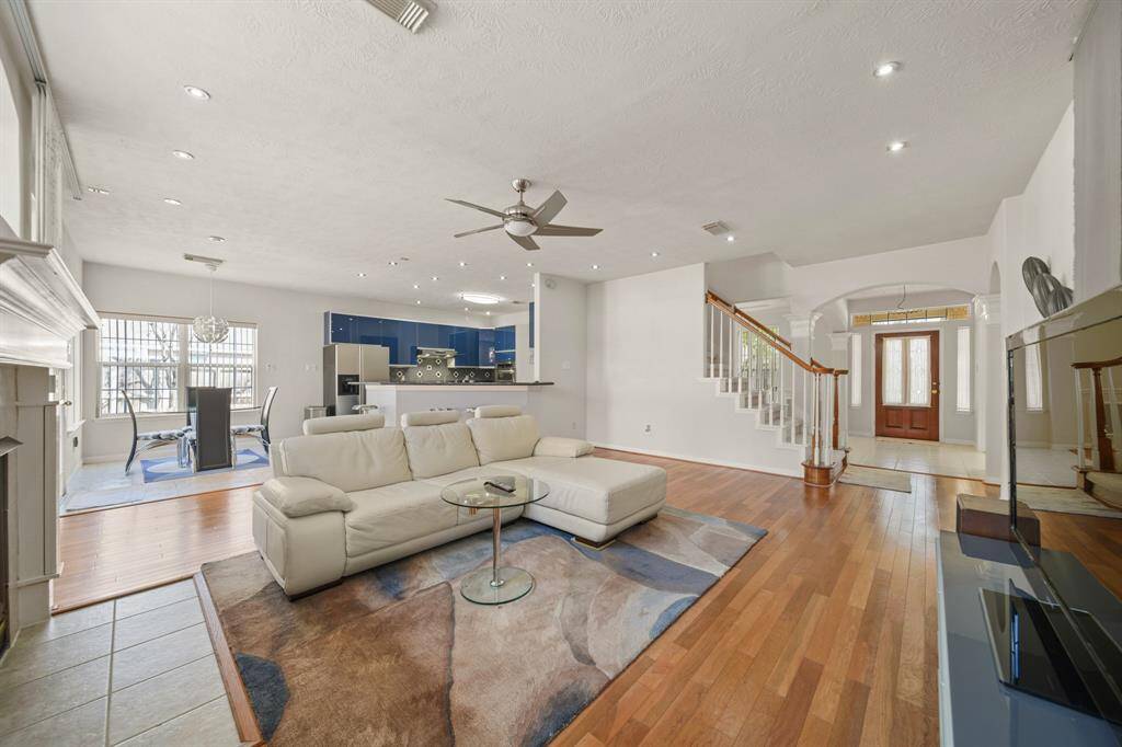 The living area located downstairs near the back of the home.