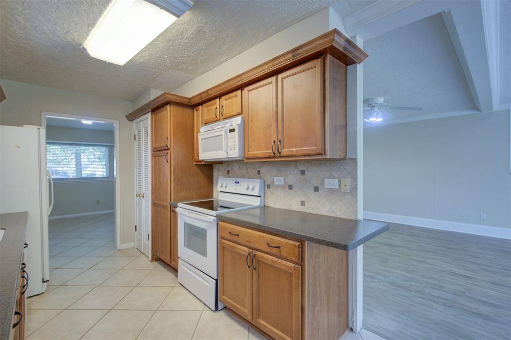 Electric oven and stove top. Built in microwave, pantry and so much storage!