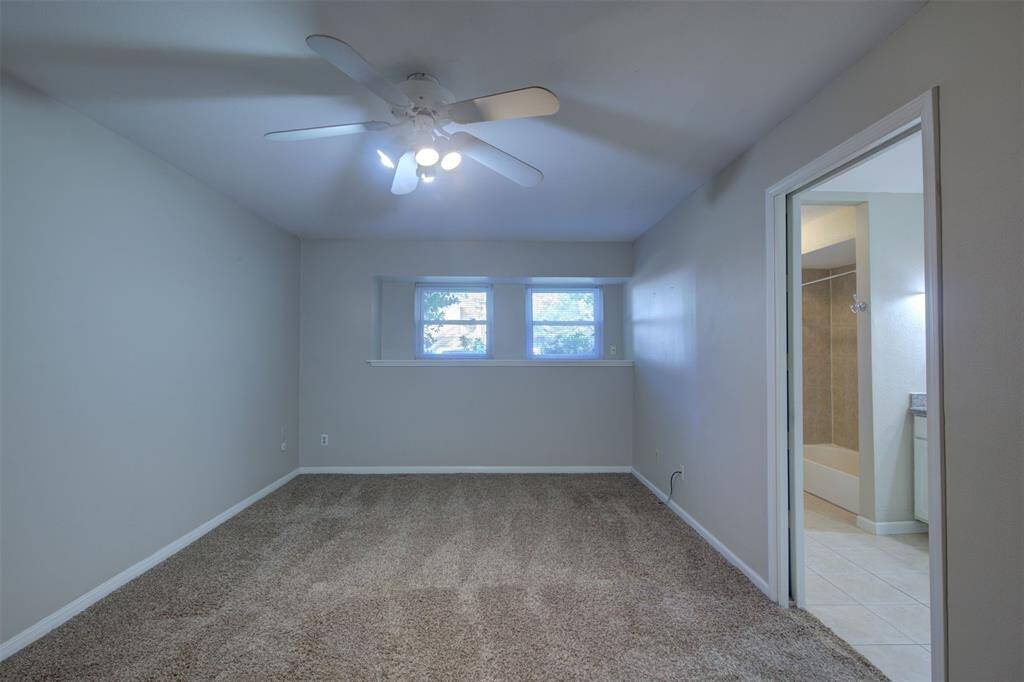 Primary bedroom is downstairs. Recently replaced carpet, great windows, neutral paint, and ensuite bath!