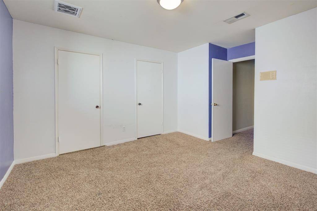 Secondary bedroom upstairs with recently replaced carpet and great closet space!
