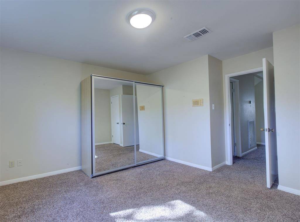 This is bedroom number five, also upstairs. Recently replaced carpet and neutral paint. This room has the additional wardrobe due to the secret room attached to its original closet!
