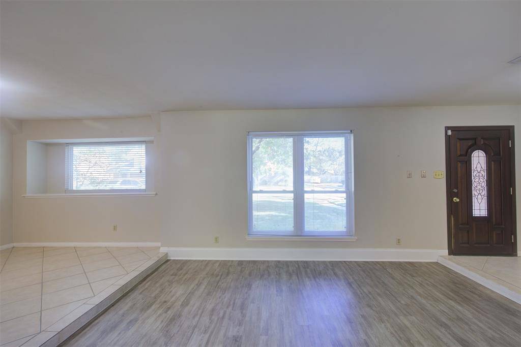 As you enter, you will see the formal living and formal dining room. Vinyl plank floors and tile make for great durability and clean up! The house has neutral paint and so much natural light from the beautiful windows!