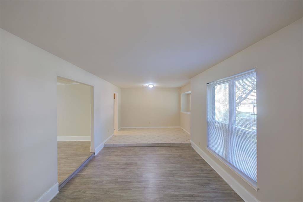 The formal living room could easily be a playroom, a home office, or a game room!
