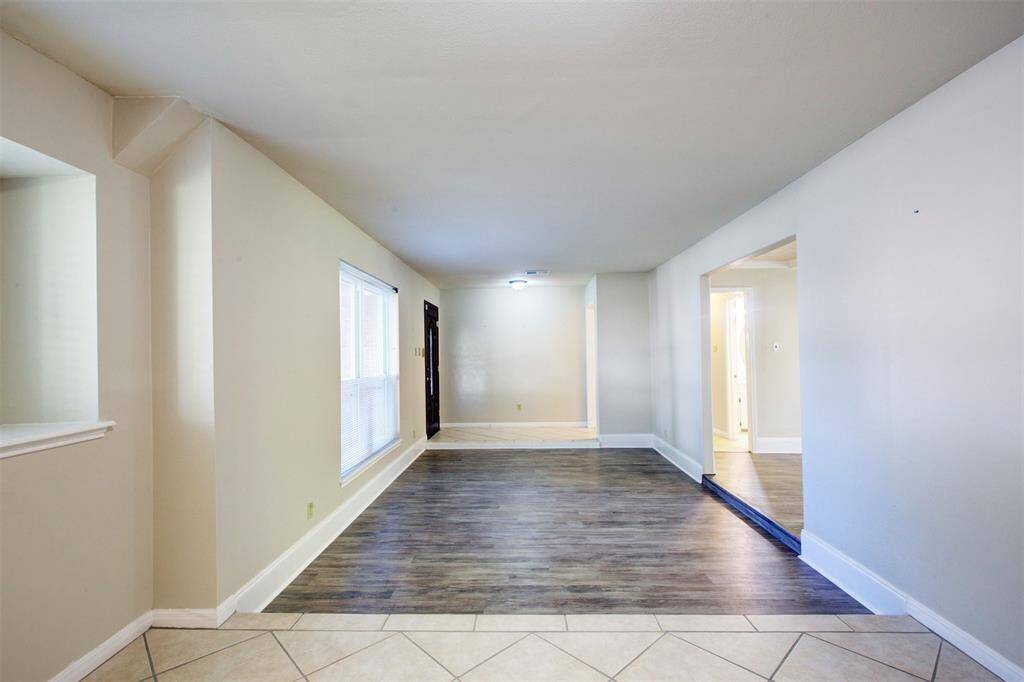 From the formal dining room looking into the formal living room and the entry. So many possibilities for this spacious area!