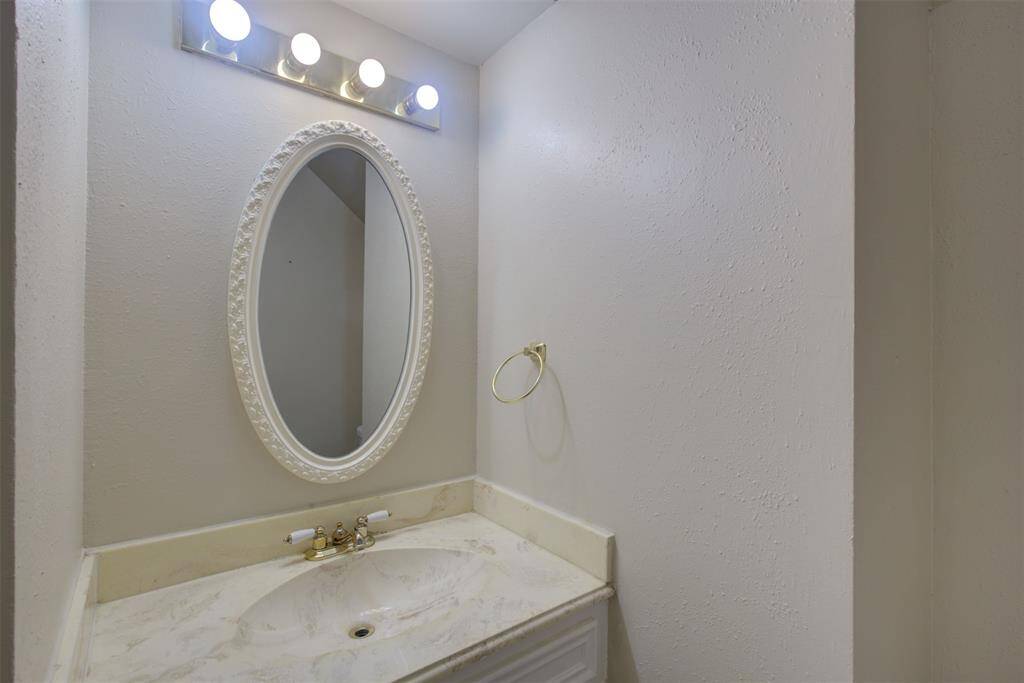 Half bath located just off of the entry downstairs.