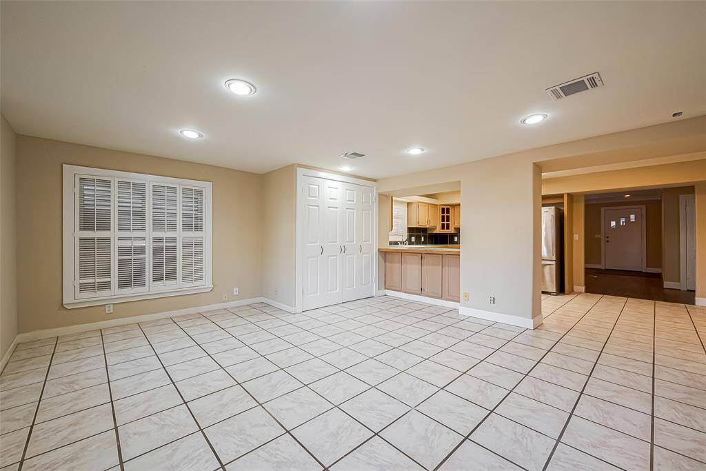 Great view of the den looking back toward the kitchen and living/dining areas.