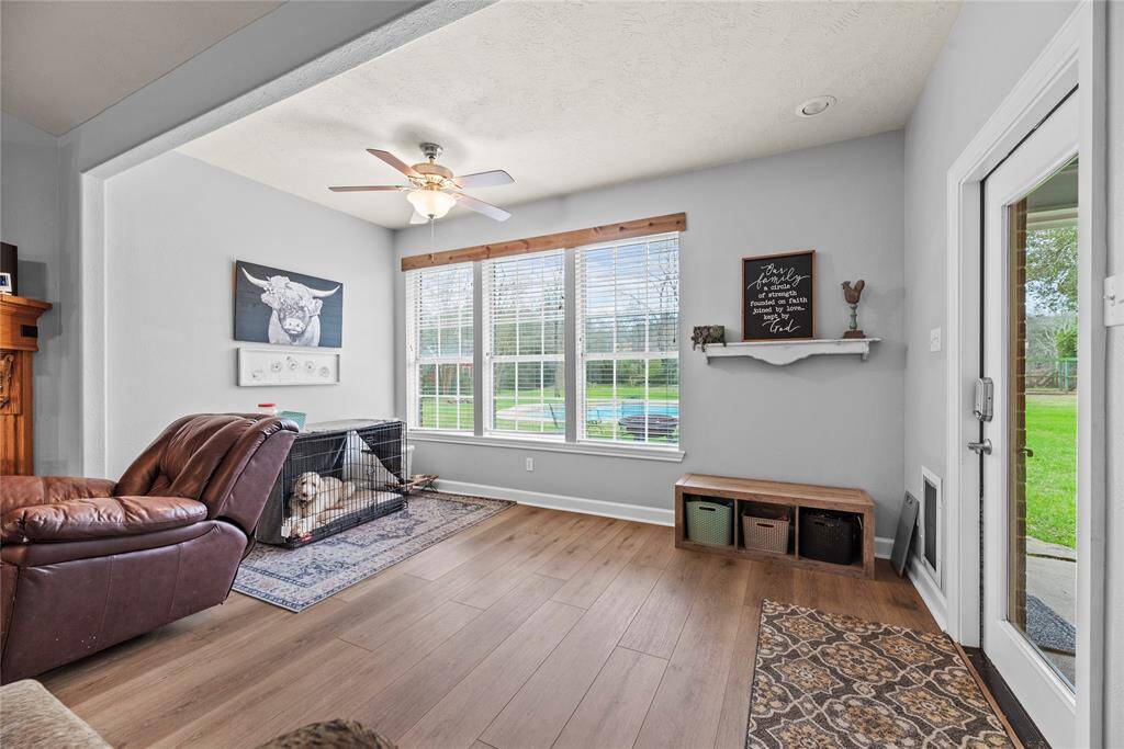 The adjoining sunroom is a great space for a sitting area to enjoy morning coffee with a view!