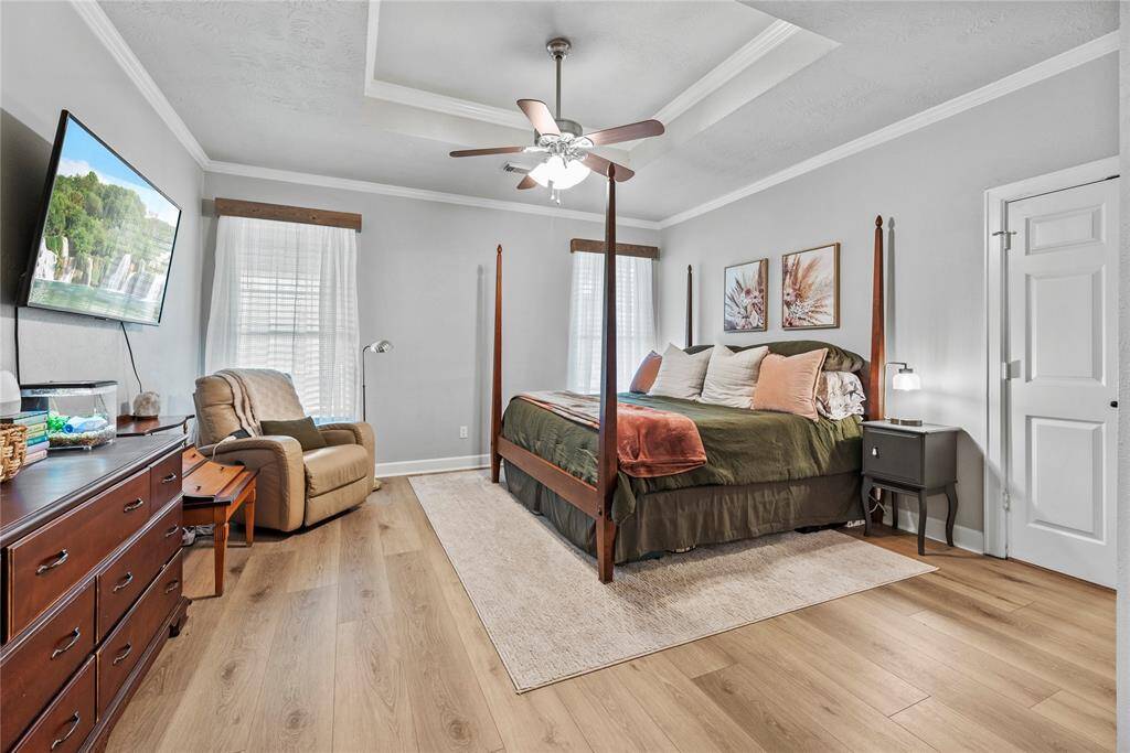 This private owner’s retreat is a great space to begin and end your day. This suite offers luxurious vinyl plank flooring, neutral paint, a raised tray ceiling with crown molding and a lit fan, a massive walk-in closet and a luxurious ensuite bathroom.