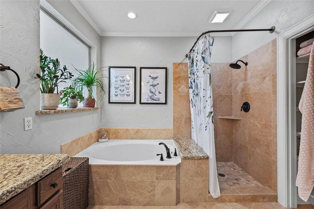 Relax and soak your worries away in this luxurious soaking tub or enjoy a quick rinse in the spacious walk-in shower. Either way, you'll love this private retreat.