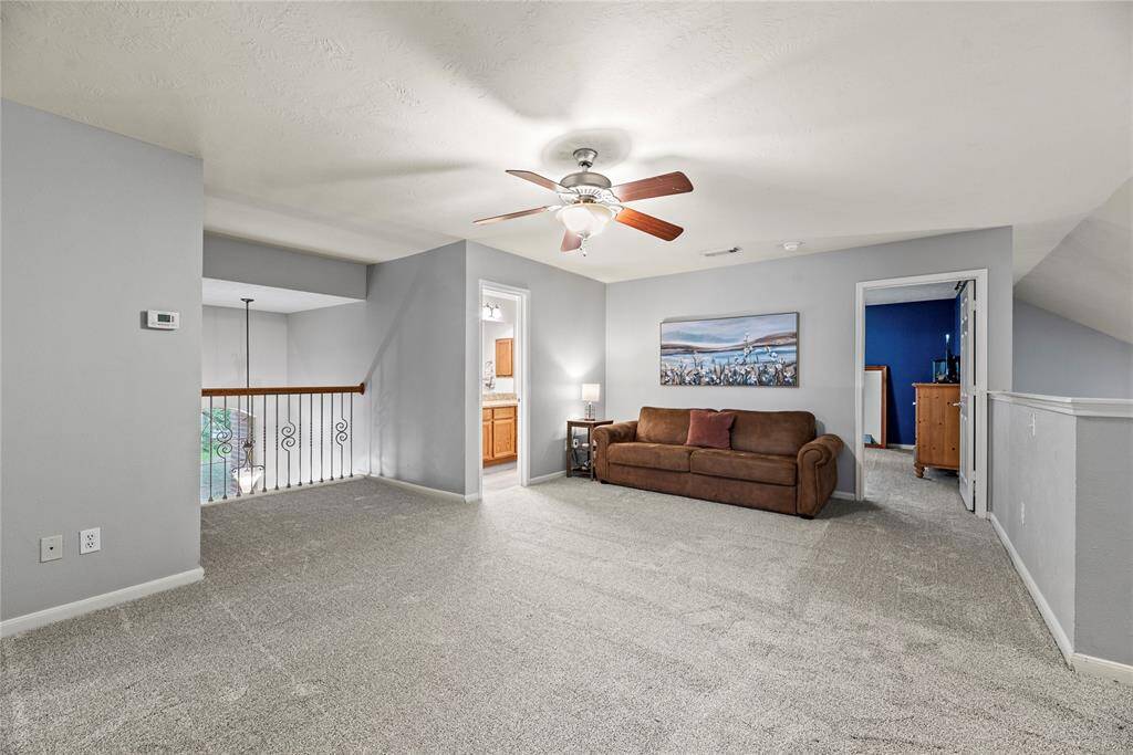 It's all fun and games upstairs with this super-sized game room with plush carpet, neutral paint, a large game closet and easy access to a full bathroom.