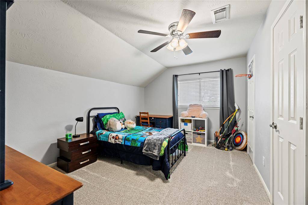 Guests will feel right at home in this spacious bedroom. This spacious bedroom offers plush carpet, neutral paint, a lit ceiling fan, a large closet (extends from door to door) and easy access to a full bathroom.