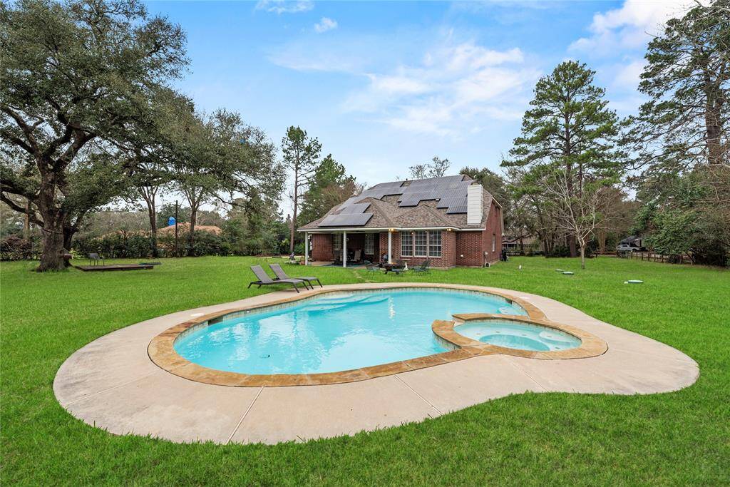 Nestled on over an acre of gated land, this exceptional property offers both sustainability and luxury. Owned solar panels provide energy efficiency, while the heated in-ground pool and spa invite year-round relaxation. With plenty of space for outdoor enjoyment and privacy, this is the perfect retreat for those who want it all.