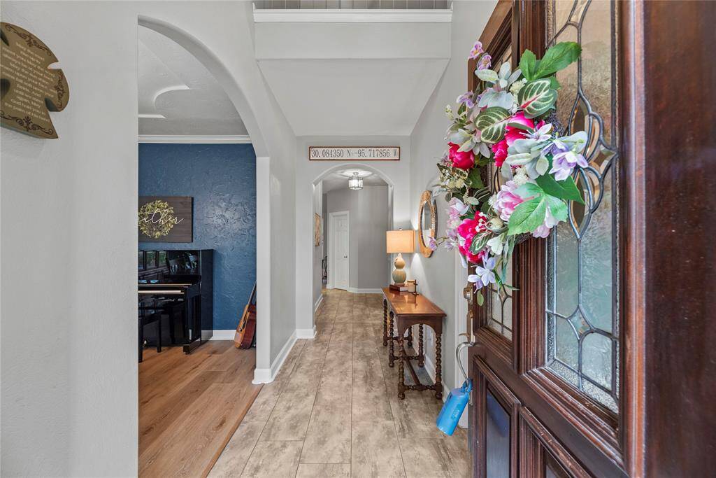 You are invited to come explore this stunning home filled with elegant features and finishes from the front door to the back.