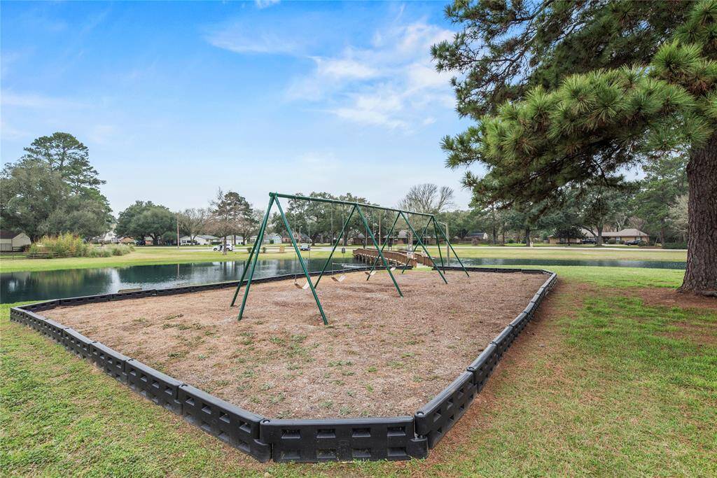 The lakeside park provides a beautiful setting for outdoor fun and games, featuring a playground and picnic areas with scenic water views.